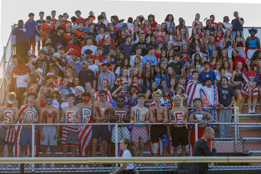 The SHS student section otherwise known as the Pack ready for red white and blue game.